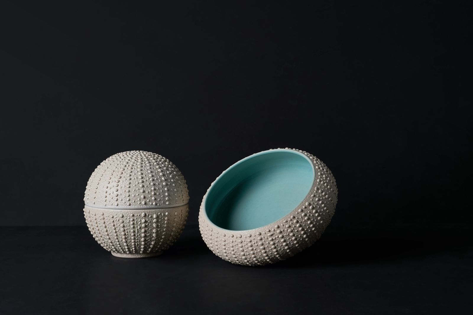 Bespoke ceramic bowls by Kevala Ceramics for InterContinental Danang Sun Peninsula Resort, featuring textured exteriors and glazed interiors inspired by coastal forms
